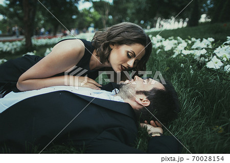 Ukraine, Couple embracing in garden Ukraine, Couple embracing in garden 70028154
