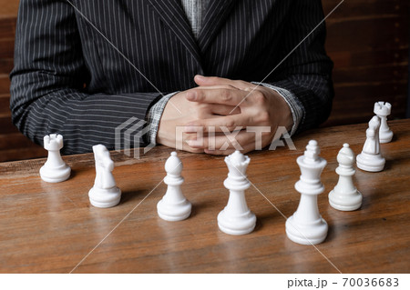 Business women and chesses with wooden background, challenges planning business strategy to success concept Business women and chesses with wooden background, challenges planning business strategy to success concept 70036683