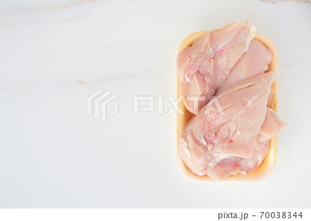 Fresh chicken meat in packaging only from the store. Chicken fillet on table with copy space Fresh chicken meat in packaging only from the store. Chicken fillet on table with copy space 70038344
