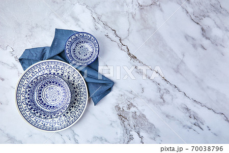 Set of modern trendy plates on marble background. Minimalistic Flat lay with tableware. Set of modern trendy plates on marble background. Minimalistic Flat lay with tableware. 70038796