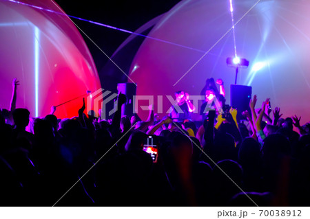 Crowd and DJs dancing during party Crowd and DJs dancing during party 70038912