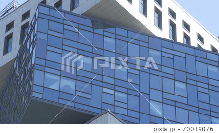 Modern Business Office Building with Glass Windows. Stylish look elite rich real estate new residential quarter. Business district. Skyscraper Glass tower in business district 70039076
