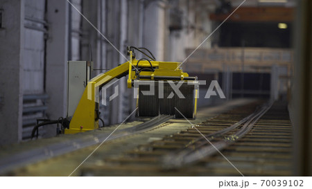 Aluminium Windows and Doors Manufacturing. Cutting aluminium profile with robotic circular saw in manufacture. Aluminium Windows and Doors Manufacturing. Cutting aluminium profile with robotic circular saw in manufacture. 70039102