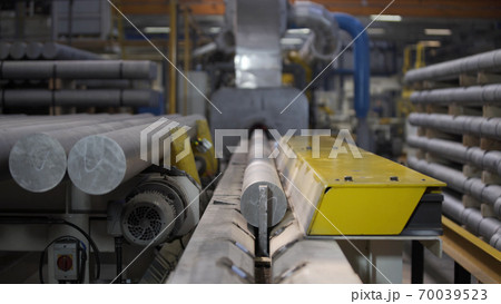 Aluminium extrusion production line factory. Production of Complex lightweight extruded aluminium metal profiles, commonly used as material in construction and manufacturing 70039523