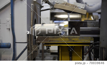 Aluminium extrusion production line factory. Production of Complex lightweight extruded aluminium metal profiles, commonly used as material in construction and manufacturing Aluminium extrusion production line factory. Production of Complex lightweight extruded aluminium metal profiles, commonly used as material in construction and manufacturing 70039646