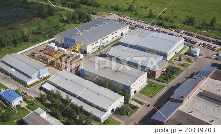 Aerial view of park production plant. Manufacturing area in field drone view. Aerial top down view of modern technology manufacturing factory. Aerial footage of building new large industrial complex 70039703
