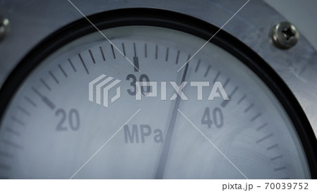 Pressure gauge in a factory, arrow movement on an industrial pressure gauge. High Precision Industrial Pressure Gauge. Vacuum Gauge With Descending Pointer in Laboratory. Differential Pressure Gauge 70039752