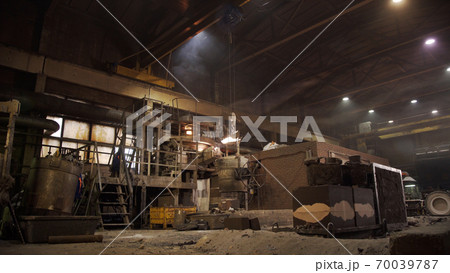Metal smelting furnace in steel mill. Molten metal pouring, metallurgy, steel casting foundry. Steel manufacturing. Casting shop for gassified models. 70039787