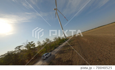Wind turbine in countryside field 70040525