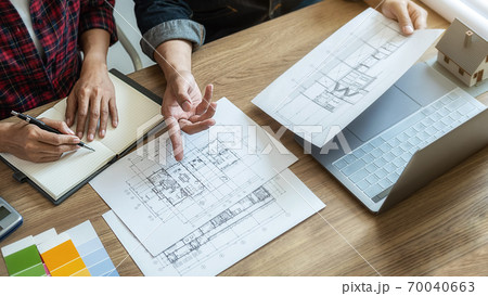Interior designer and Architect choosing color for house coloring selection in office. 70040663