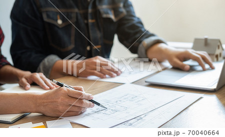 Interior designer and Architect choosing color for house coloring selection in office. 70040664