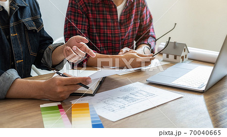 Interior designer and Architect choosing color for house coloring selection in office. 70040665