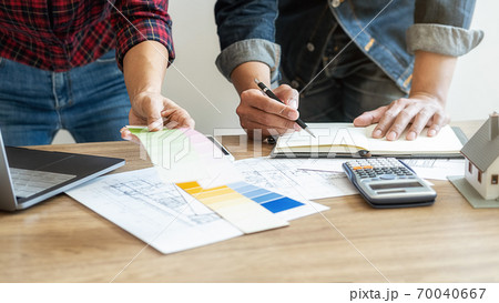 Interior designer and Architect choosing color for house coloring selection in office. 70040667