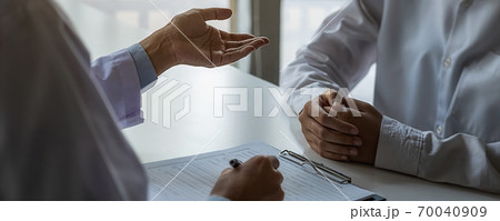 Psychiatrist consulting on diagnostic examination disease or mental illness in medical clinic. Psychiatrist consulting on diagnostic examination disease or mental illness in medical clinic. 70040909