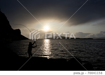Young man fishing with feathers for mackerel Color Young man fishing with feathers for mackerel Color 70041158