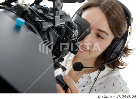 beautiful young woman with DSLR video camera 70043004