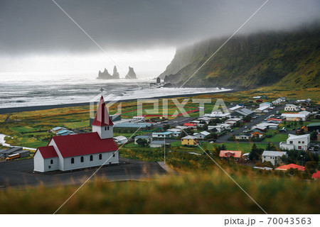 Heavy clouds over the village of Vik i Myrdal in Iceland 70043563
