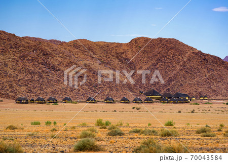 Small cabins of a desert lodge near Sossusvlei in Namibia 70043584