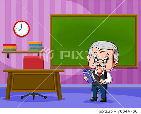 The teacher holding the book and teaching in front of the class The teacher holding the book and teaching in front of the class 70044706