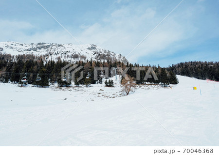 Winter landscape with mountain slopes covered with snow. Winter landscape with mountain slopes covered with snow. 70046368