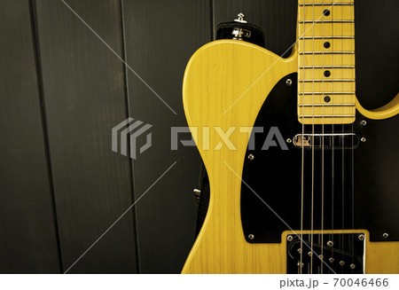 Close-up of classic electric guitar, neck with frets, microphone and steel strings 70046466