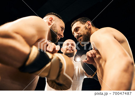 Two male boxers are exchanging angry glances 70047487