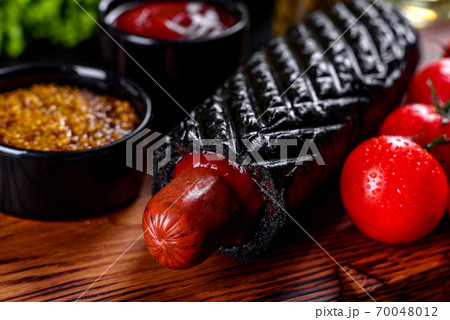 Delicious fresh hot hotdogs with various kinds of buns and sausages. 70048012