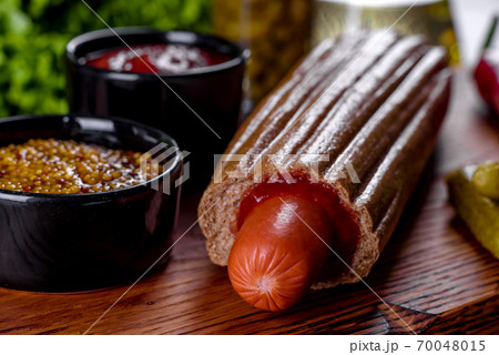 Delicious fresh hot hotdogs with various kinds of buns and sausages. 70048015