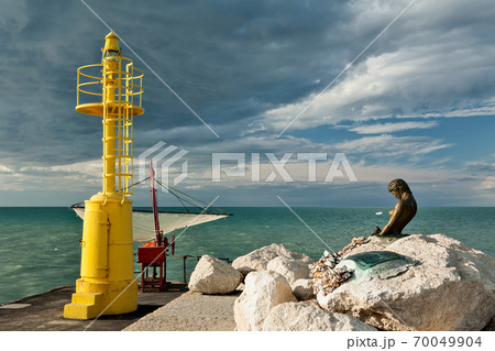The pier in Senigallia at sunset. The pier in Senigallia at sunset. 70049904