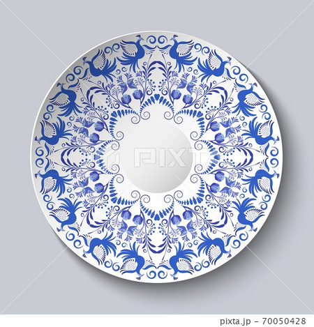 Decorative plate with a blue ornament of birds and flowers. Template design in ethnic style Gzhel porcelain painting. 70050428