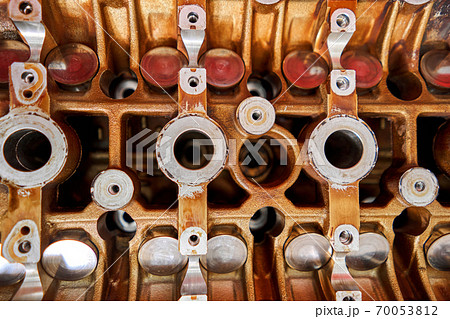 Disassemble engine block vehicle. Motor capital repair. Sixteen valve and four cylinder. Car service concept. The job of a mechanic. Old and new pistons. Top view 70053812