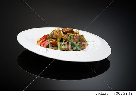 meat salad with bell pepper on a black background, isolated meat salad with bell pepper on a black background, isolated 70055348