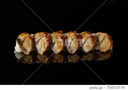 sushi with rice and sesame seeds on a dark background with reflection 70055774