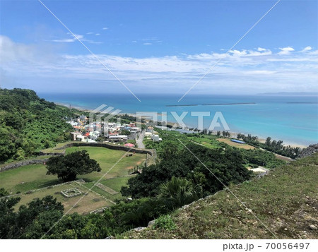 Blue sky and greenery seen from top of Katsuren Castle, Okinawa, Japan. The ruins visible in this photo were once a throne hall.  UNESCO world heritage site. 70056497