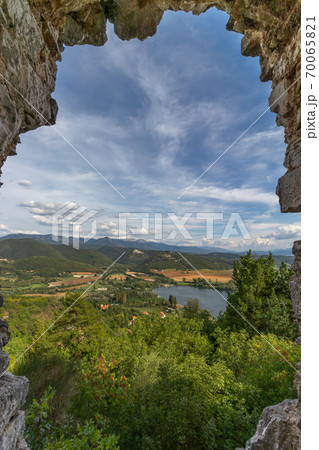 Beautiful lake Piediluco view and the ancient town Labro from the window of an old ruined castle Beautiful lake Piediluco view and the ancient town Labro from the window of an old ruined castle 70065821