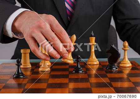 Close Up of Hands Hackers Colleagues Playing Chess Game to