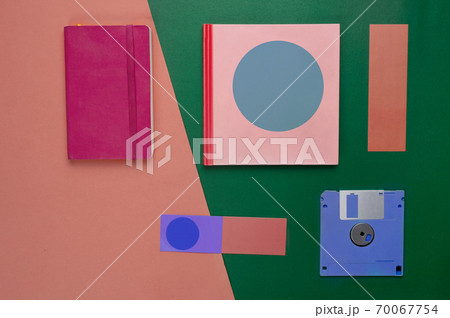 pink red notebook paper and blue diskette in retro or vintage style business green orange background pink red notebook paper and blue diskette in retro or vintage style business green orange background 70067754