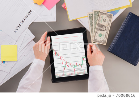Business woman trading online on tablet pc. Business woman trading online on tablet pc. 70068616