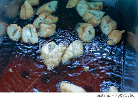 Fried Fish Balls in hot oils 70071566