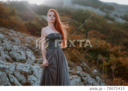 beautiful furious scandinavian warrior ginger woman in grey dress beautiful furious scandinavian warrior ginger woman in grey dress 70072415