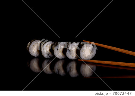Fresh delicious beautiful sushi rolls on a dark background 70072447