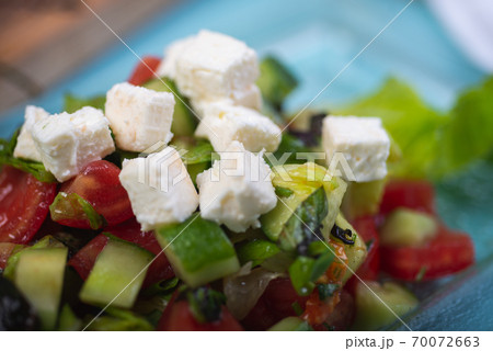 Fresh salad from chopped vegetables. 70072663