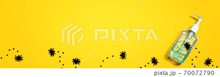 Sanitizer bottle with black spiders 70072790