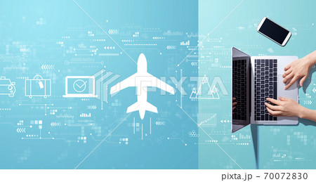 Flight ticket booking concept with person working with laptop 70072830