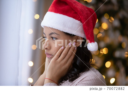Sad african American woman feel lonely on Christmas day Sad african American woman feel lonely on Christmas day 70072882