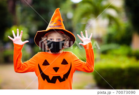 Kids trick or treat. Halloween in face mask. Kids trick or treat. Halloween in face mask. 70073090