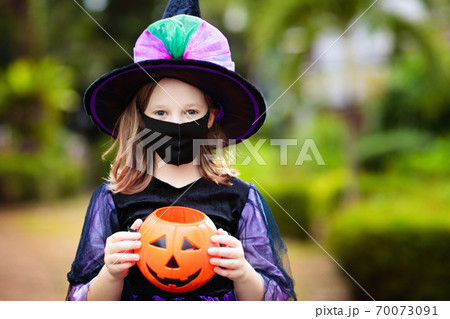 Kids trick or treat. Halloween in face mask. Kids trick or treat. Halloween in face mask. 70073091