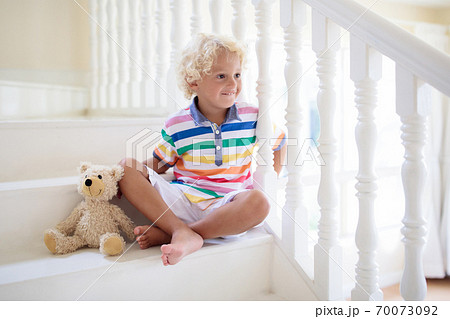 Kids on stairs. Child moving into new home. Kids on stairs. Child moving into new home. 70073092