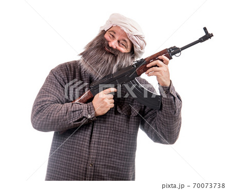 The bearded man armed with kalashnikov isolated on a white background. 70073738