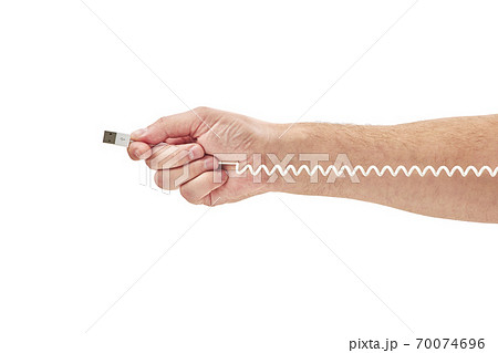 Hand holding USB cable on white background 70074696